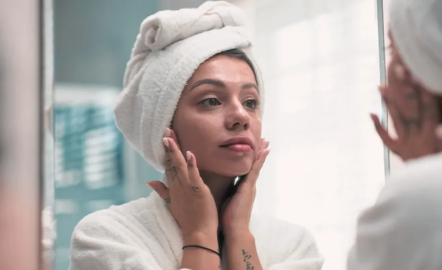 woman applying moisturizer for sensitive skin