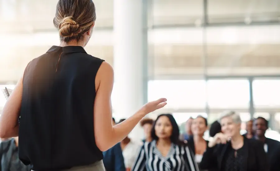 woman speaking in meeting with confidence