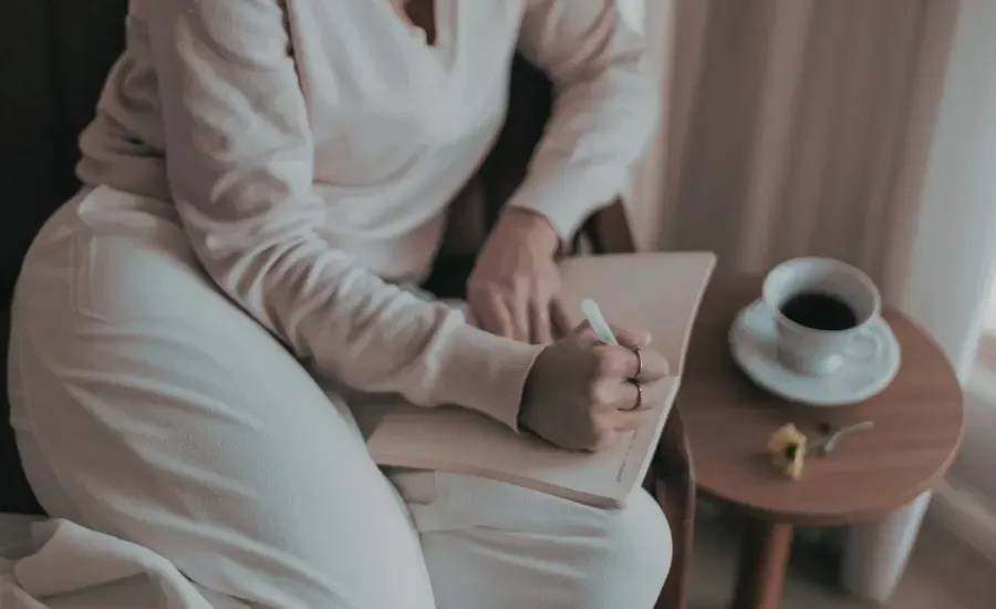consistent woman journaling