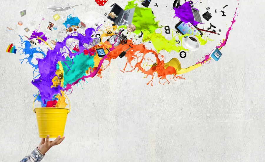 hand holding a bucket that exudes colors