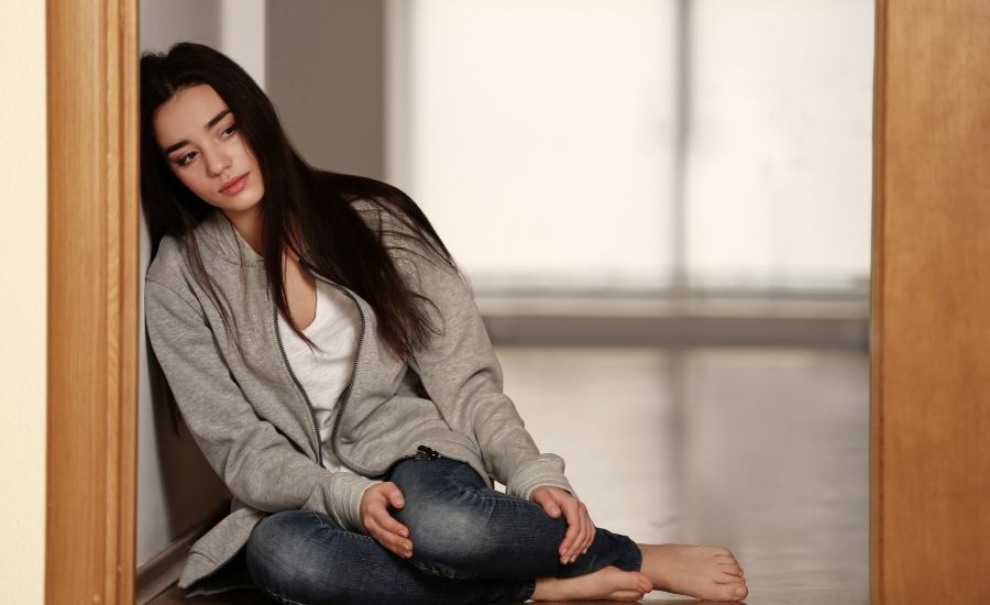 woman on the floor sad