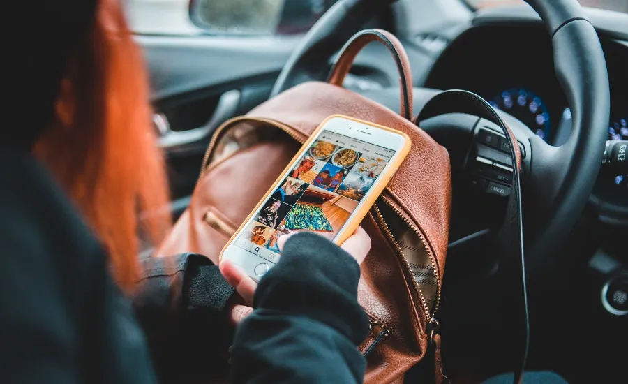 woman in car oversharing on social media